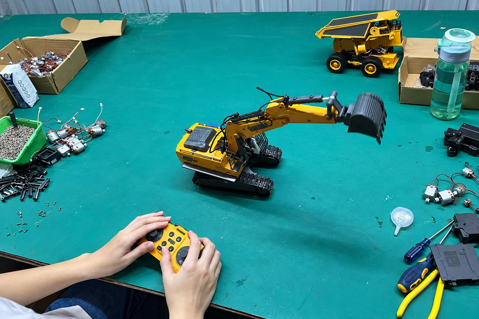 RC excavator function testing with a handheld remote