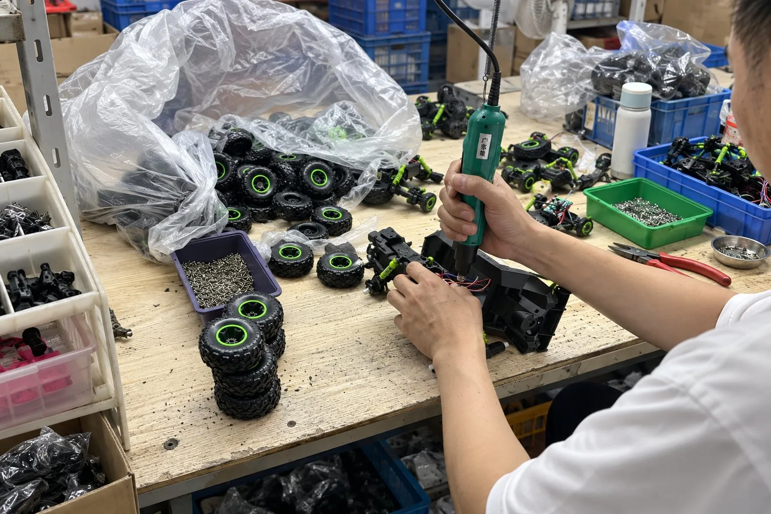 Manual assembly of a green-wheel RC stunt car